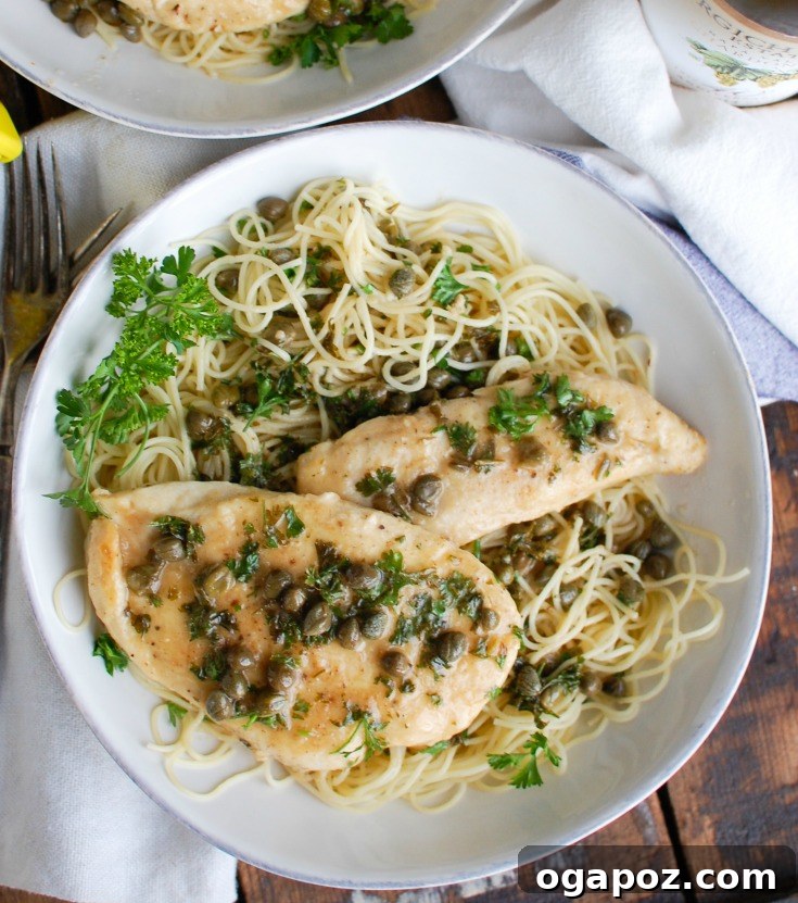 Zesty Lemon Caper Chicken 4 Two pieces of golden-brown Chicken Piccata on a plate, ready to be sauced.