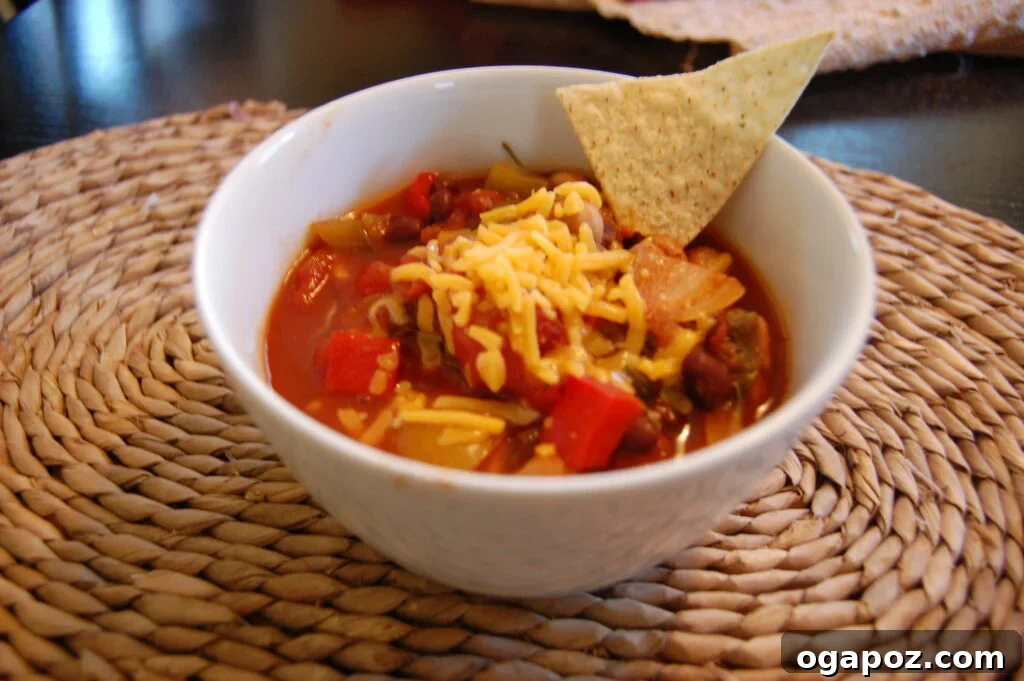 Crockpot Chickpea Chili Delicious and hearty Crockpot Chickpea Chili, garnished with fresh cilantro and cheese.