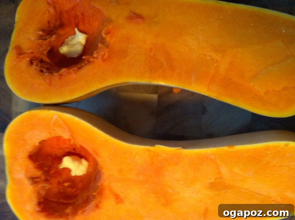 Adding Margarine/Oil to Squash Butternut squash halves with margarine or olive oil in the cavities