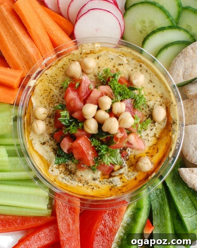 15 Mediterranean Appetizers to Delight Your Taste Buds 8 Creamy hummus is topped with diced tomatoes, fresh parsley and mint, chickpeas, pine nuts and a squeeze of lemon juice. Serve this with a rainbow of vegetables and whole wheat pita.