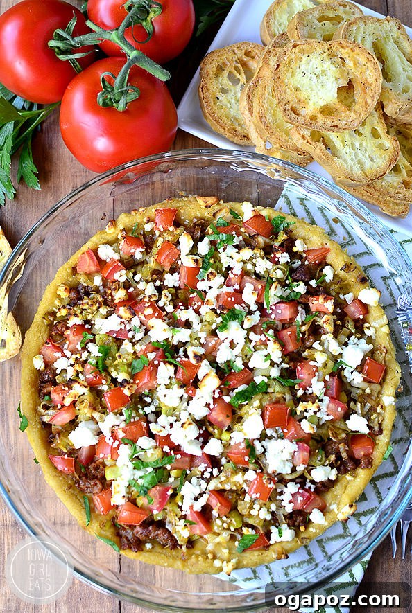 15 Mediterranean Appetizers to Delight Your Taste Buds 4 Store-bought hummus is spread into a pie pan then topped with browned sausage, sauteed leeks, chopped tomatoes, and crumbled feta cheese with crostini made from baguettes
