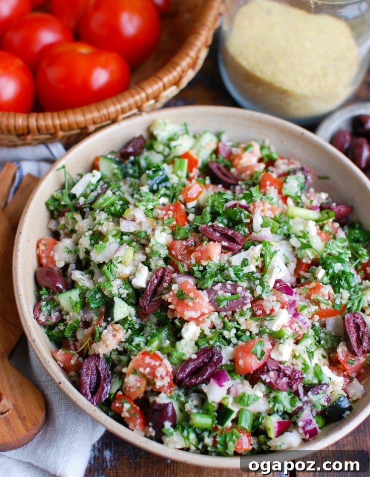 Vibrant Greek Tabbouleh Salad 2 A vibrant bowl of Greek Tabbouleh, showcasing fresh vegetables, olives, and feta.