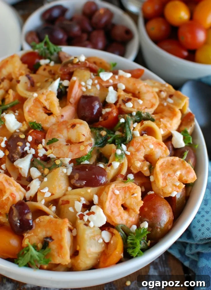 Delicious One Pot Mediterranean Shrimp Pasta in a rustic bowl, garnished with fresh parsley, highlighting the succulent shrimp, pasta, and vibrant vegetables