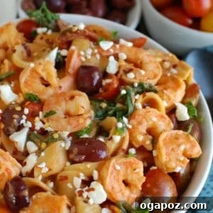 One Pot Mediterranean Shrimp Pasta served in a bowl, top view, garnished with fresh herbs