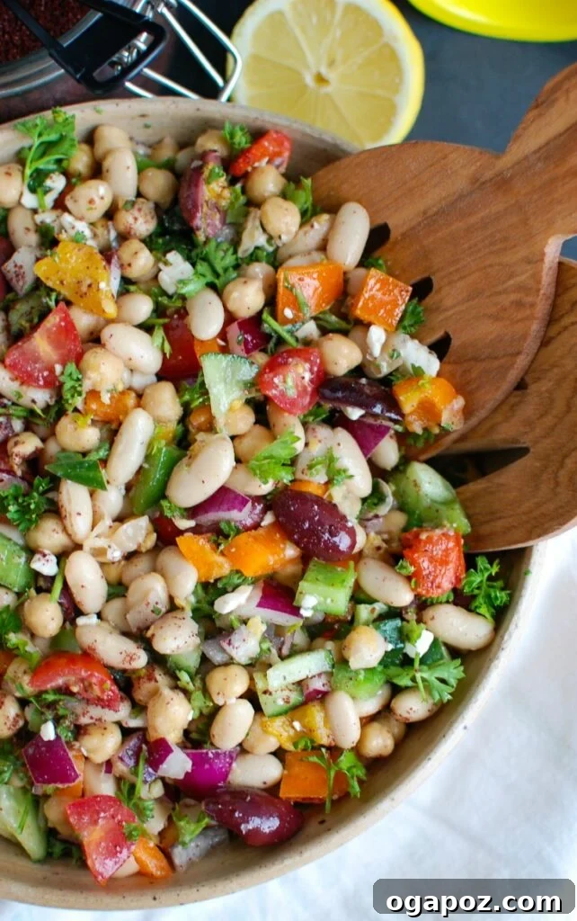 Vibrant Mediterranean Bean Salad 6 Mediterranean Bean Salad being served with tongs