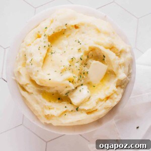Mashed potatoes in a bowl with butter.