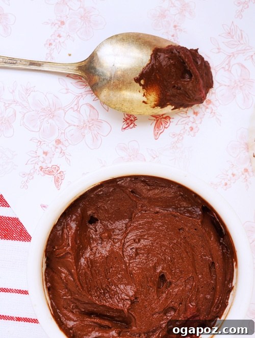 Chocolate Raspberry Invert Cakes 5 Individual ramekins filled with raspberries and chocolate batter, ready for baking.