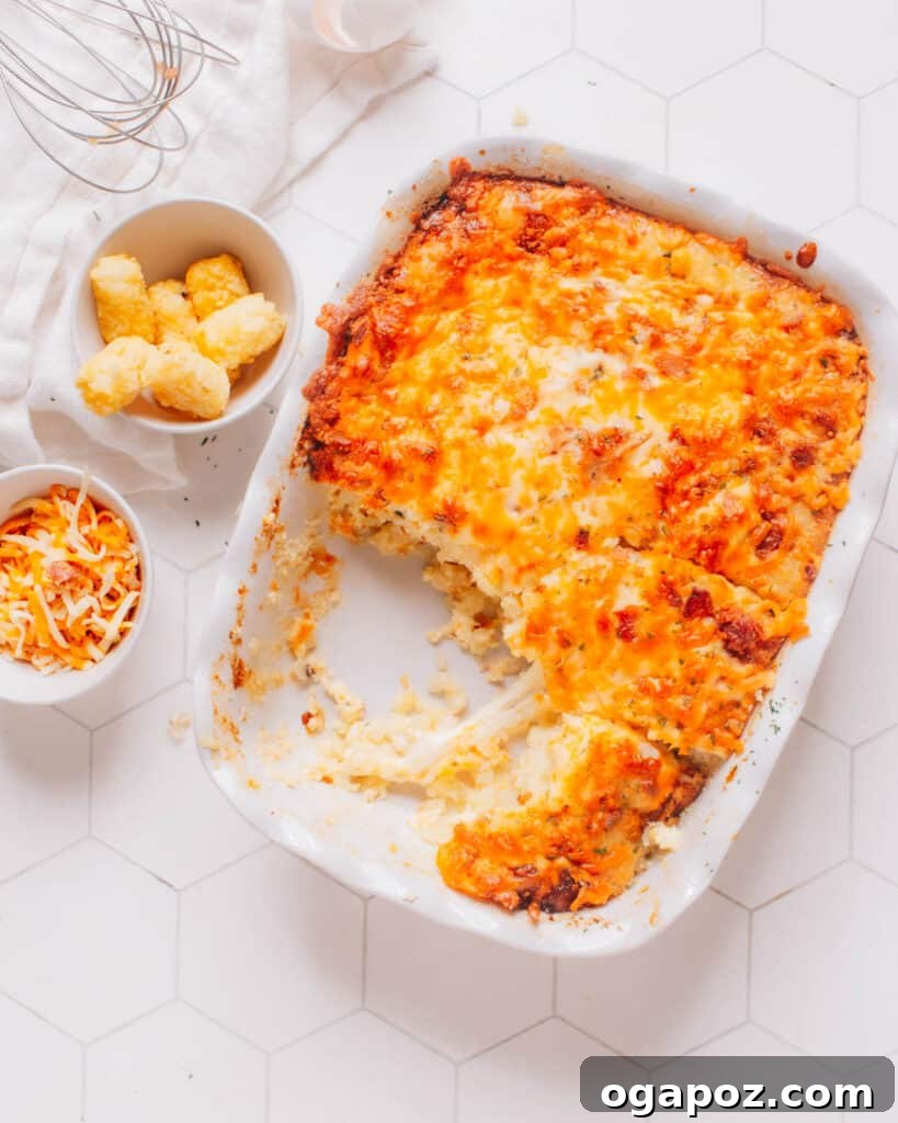 Golden Tater Tot Morning Bake 5 Tater tot breakfast casserole with a piece removed.