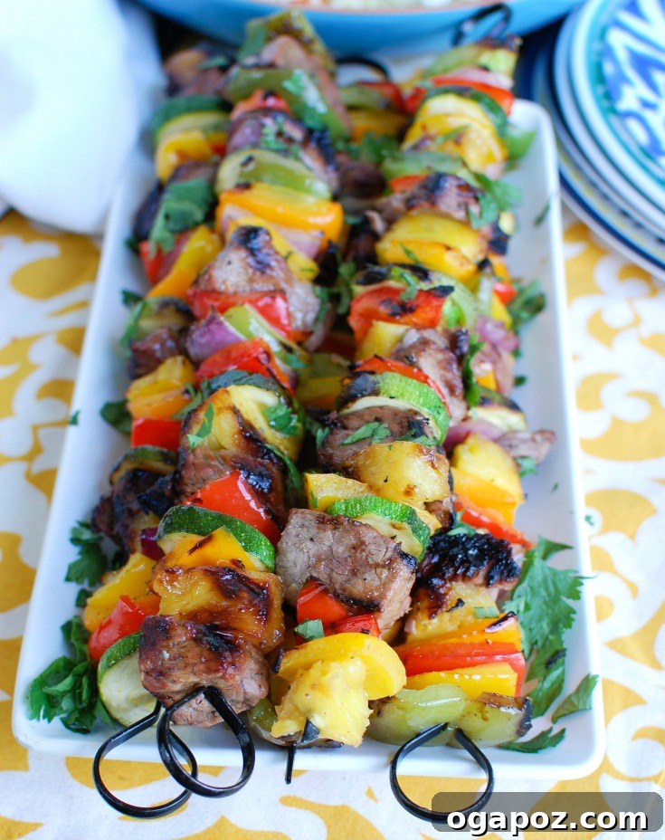 Island Paradise Steak Skewers 3 Grilled Hawaiian Steak Kabobs Served on White Plate