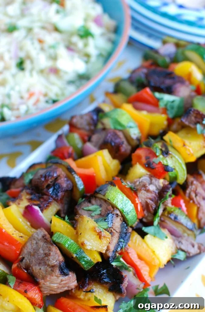 Island Paradise Steak Skewers 4 Grilled Hawaiian Steak Kabobs Side View - Colorful and ready to serve