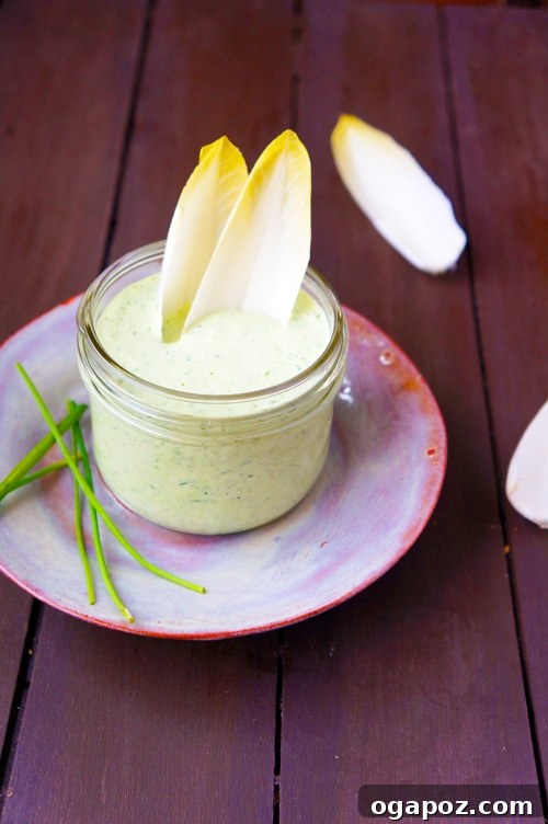 A close-up of Green Goddess Dressing being served with Belgian endive leaves
