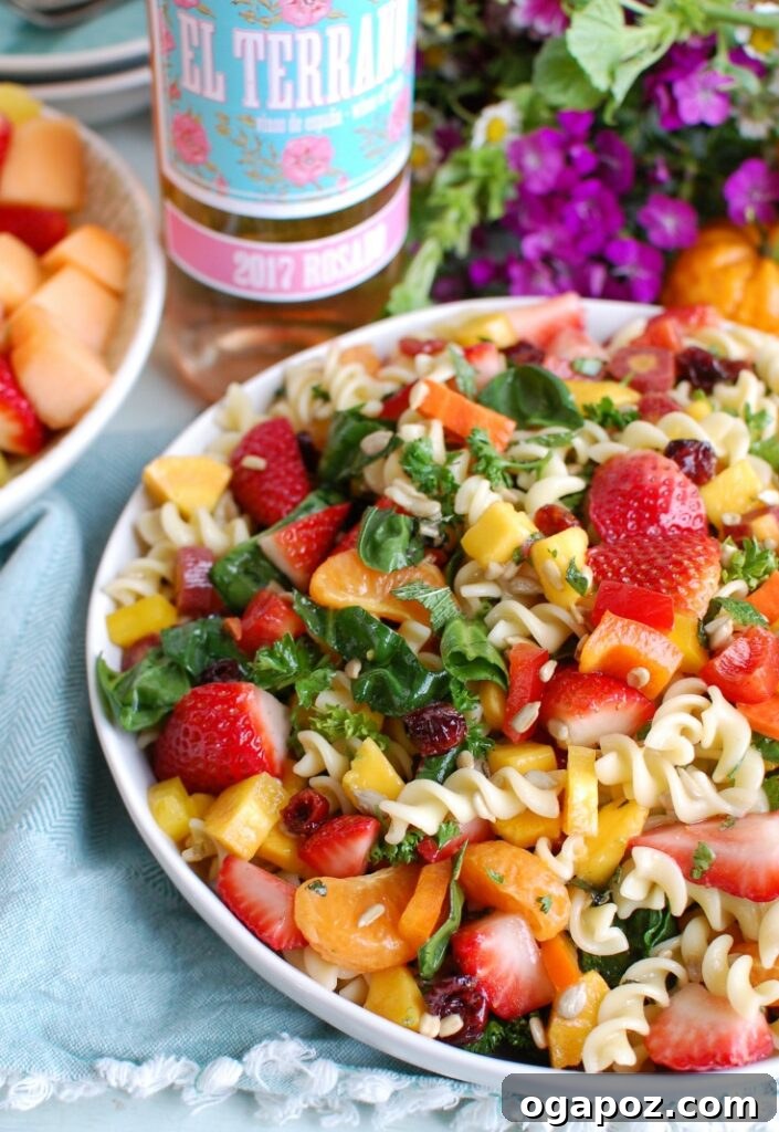 Spring Pasta Salad beautifully plated with a glass of rose wine, ready for a special occasion