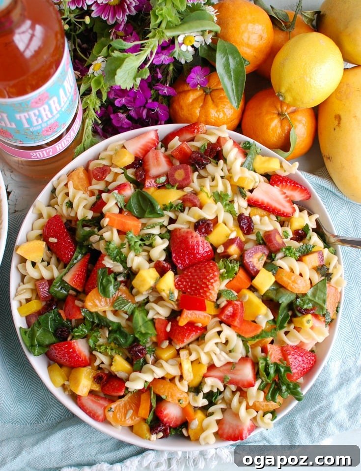 Overhead shot of a large bowl of Spring Pasta Salad, showcasing its abundant ingredients