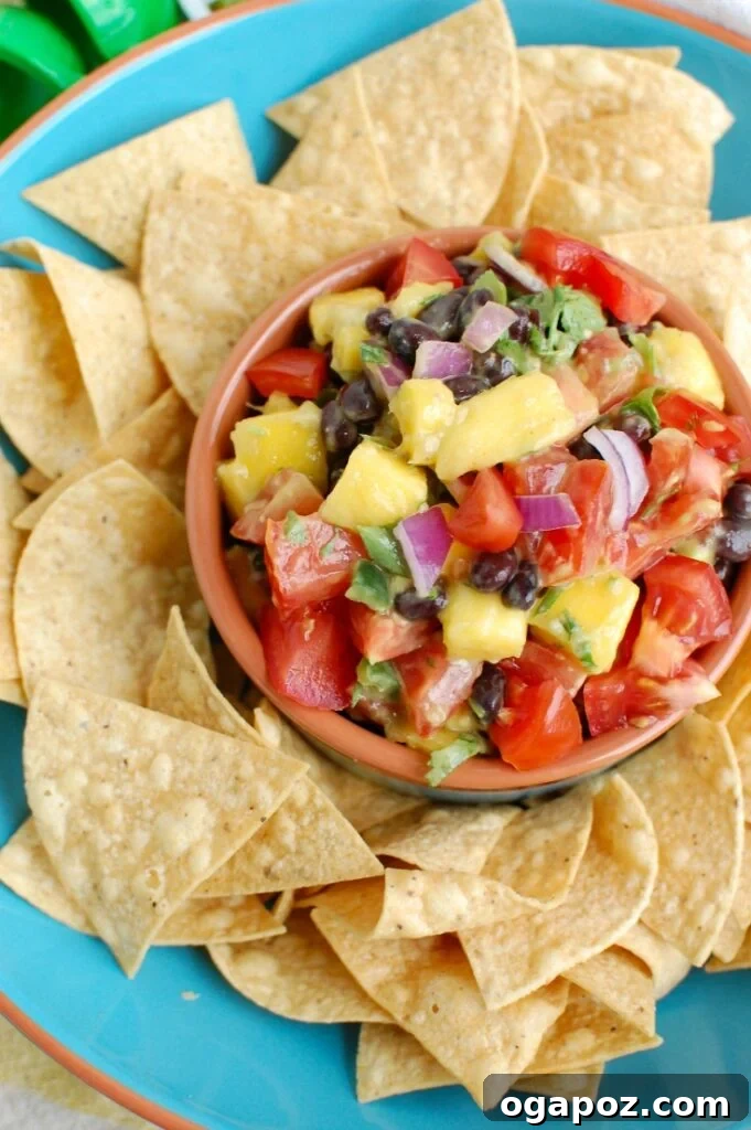 Blue ceramic bowl filled with freshly made Mango and Black Bean Salsa, ready to be served