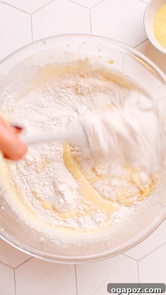 Golden Cornbread Delight 11 Combining wet and dry ingredients.