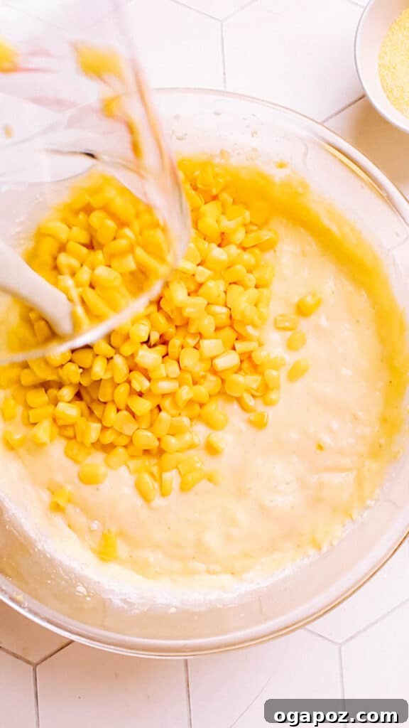 Golden Cornbread Delight 12 Adding corn kernels.