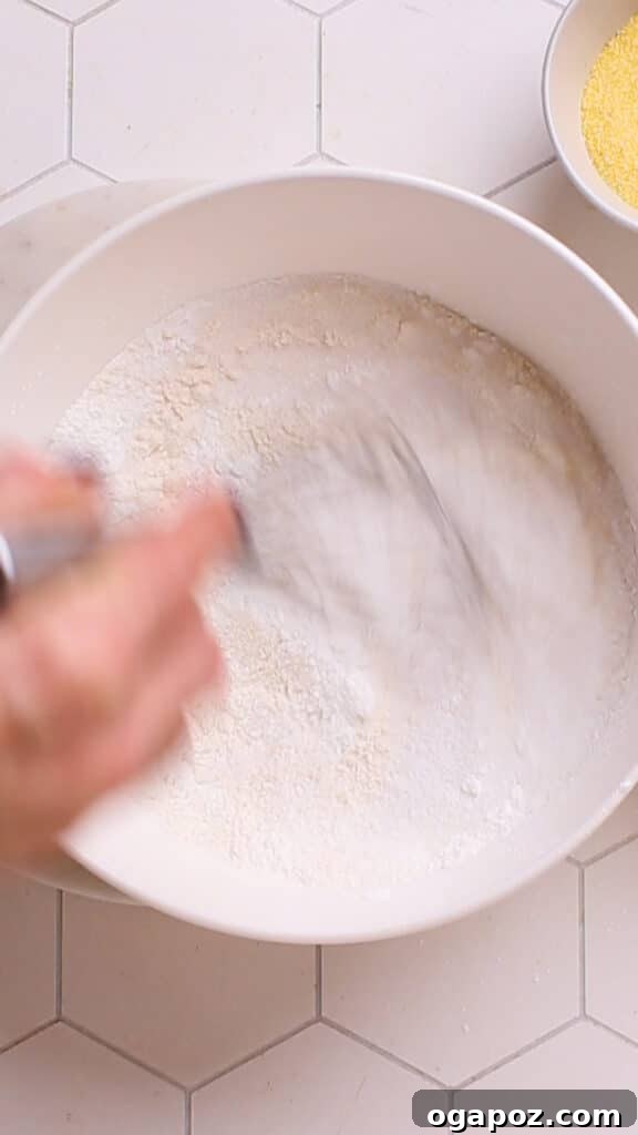 Golden Cornbread Delight 9 Mixing flour and dry ingredients for cornbread casserole.
