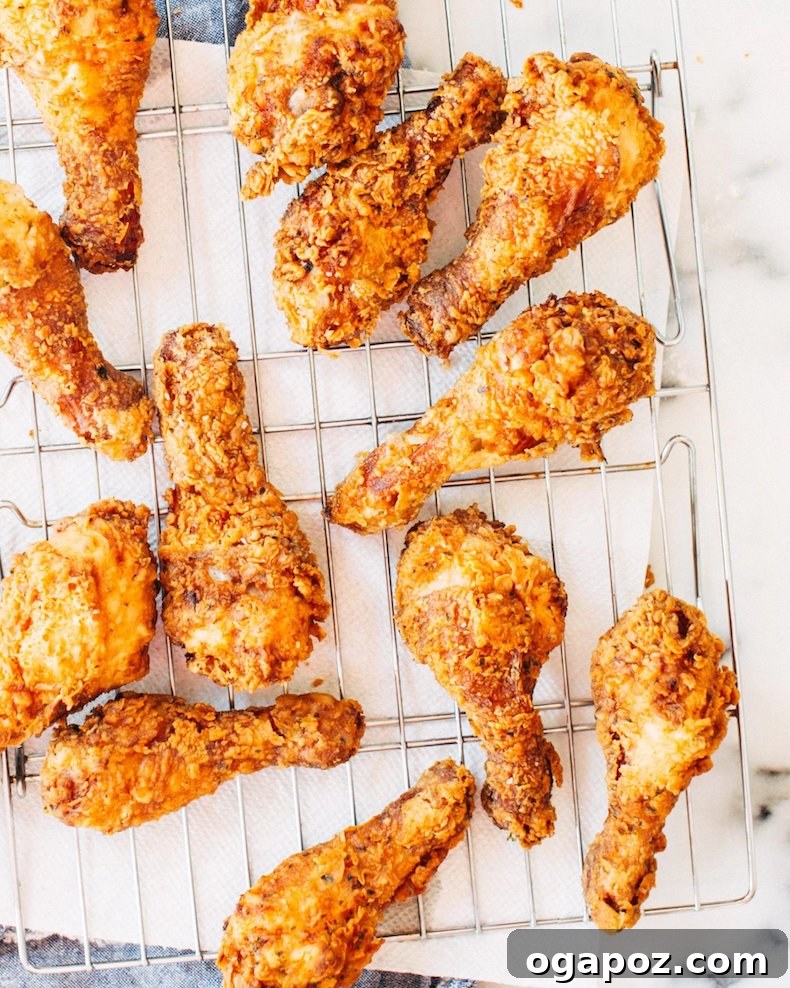 Classic Velvety Baked Macaroni and Cheese 17 A plate of light and crispy fried chicken, perfectly golden brown.