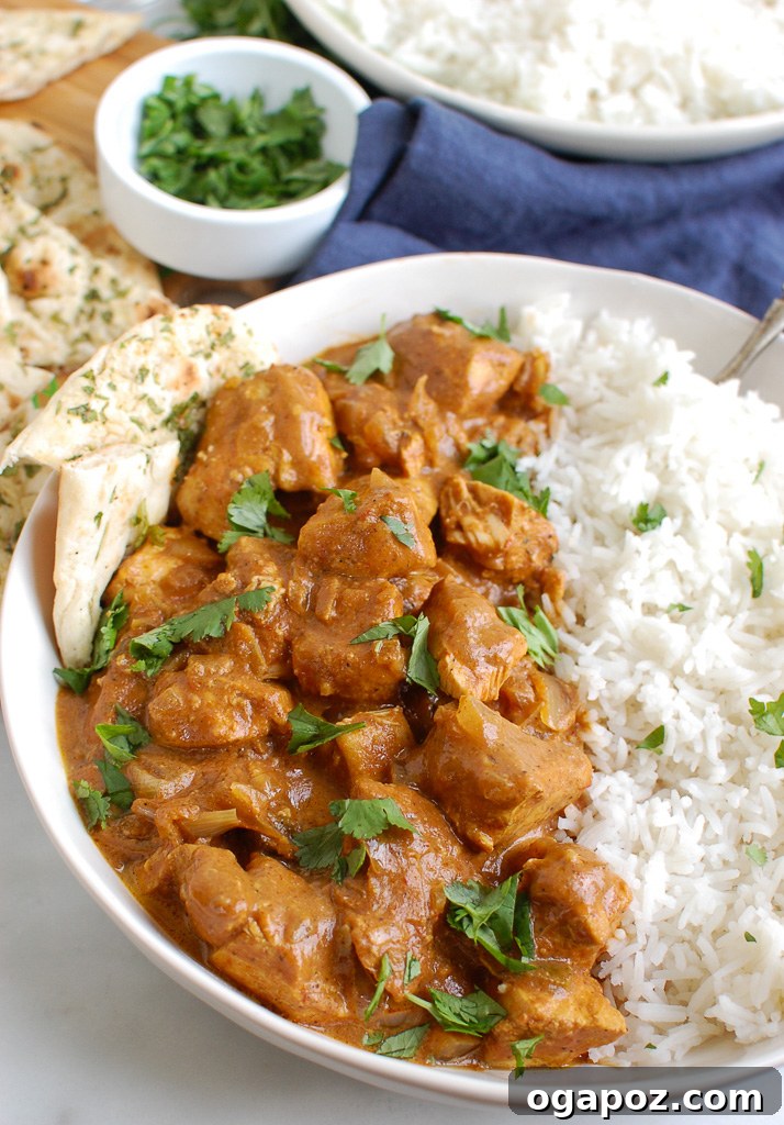 Meltingly Tender Slow Cooker Butter Chicken 6 Slow Cooker Butter Chicken served with warm naan bread and basmati rice