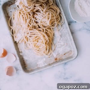 Handcrafted Pasta Perfection 6 Fresh pasta on a baking sheet, ready for cooking.