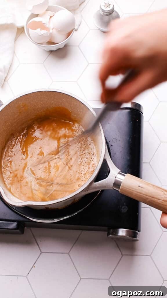 Tender Meatloaf, Velvety Brown Gravy 13 Adding broth to the roux for gravy.
