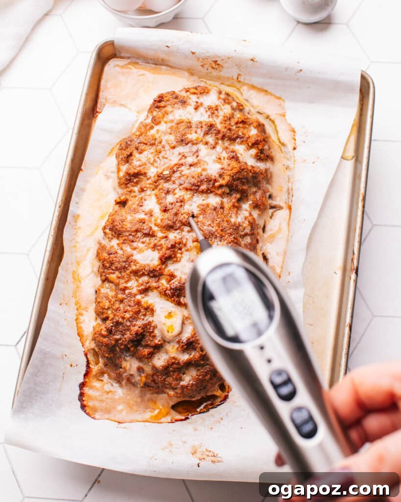 Tender Meatloaf, Velvety Brown Gravy 6 Checking meatloaf temperature with an instant thermometer.