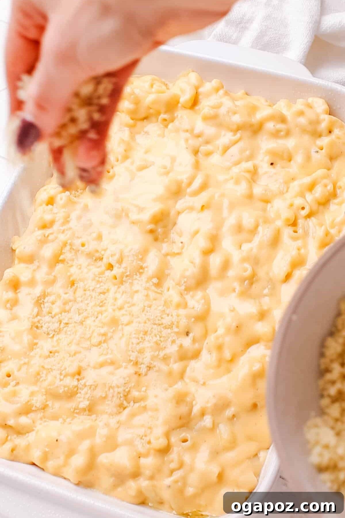 Liquid Gold Mac and Cheese Sauce 11 Adding bread crumbs on baked macaroni and cheese.
