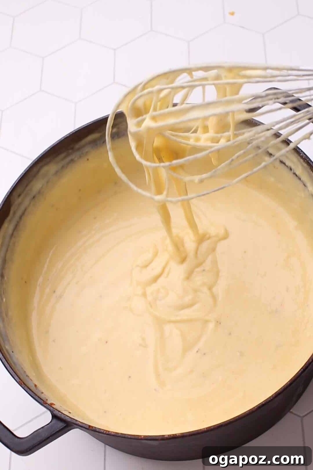Liquid Gold Mac and Cheese Sauce 12 Whisking cheese sauce for mac and cheese.
