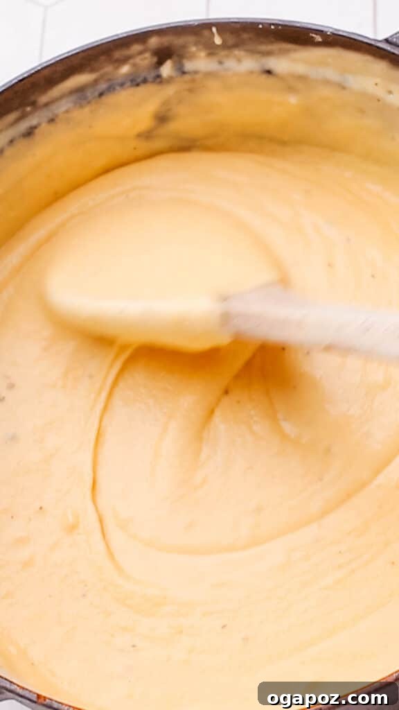 Liquid Gold Mac and Cheese Sauce 10 Stirring cheddar cheese sauce for maroni and cheese.