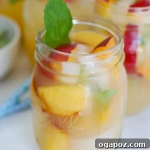 Sparkling Peach Lemonade in a decorative Mason Jar, ready to be served