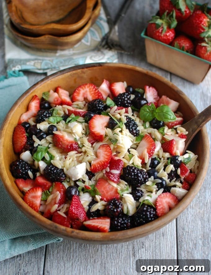 9 Unforgettable Orzo Pasta Salads 11 Unique Mixed Berry Caprese Orzo Salad with fresh berries, mozzarella pearls, basil, and a balsamic glaze.
