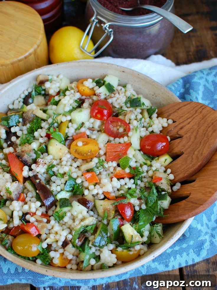 Sun-Kissed Mediterranean Grilled Vegetable Couscous Salad 2 Vibrant Mediterranean Grilled Vegetable Couscous Salad, a healthy and delicious summer dish with grilled zucchini, eggplant, bell peppers, tomatoes, cucumber, herbs, and a lemon dressing.