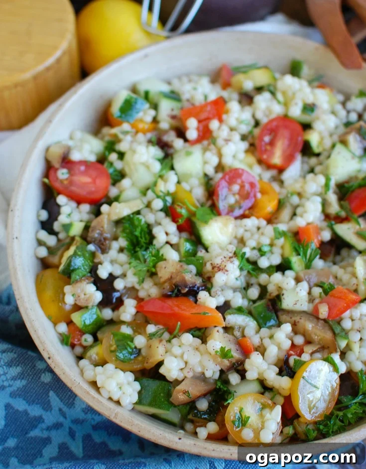 Sun-Kissed Mediterranean Grilled Vegetable Couscous Salad 6 A large white bowl brimming with fresh Mediterranean Grilled Vegetable Couscous Salad, showing off the colorful, healthy ingredients.