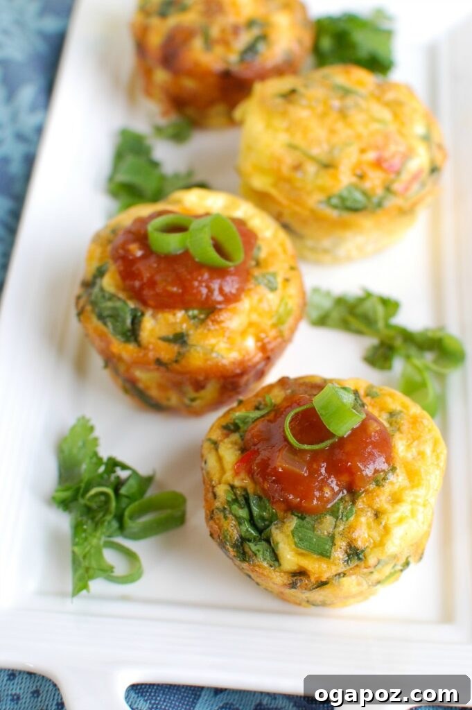 Southwest Turkey Sausage Sunrise Bites 3 Close-up shot of baked Southwestern Turkey Sausage Egg Muffins, showing ingredients like sausage, bell peppers, and cheese