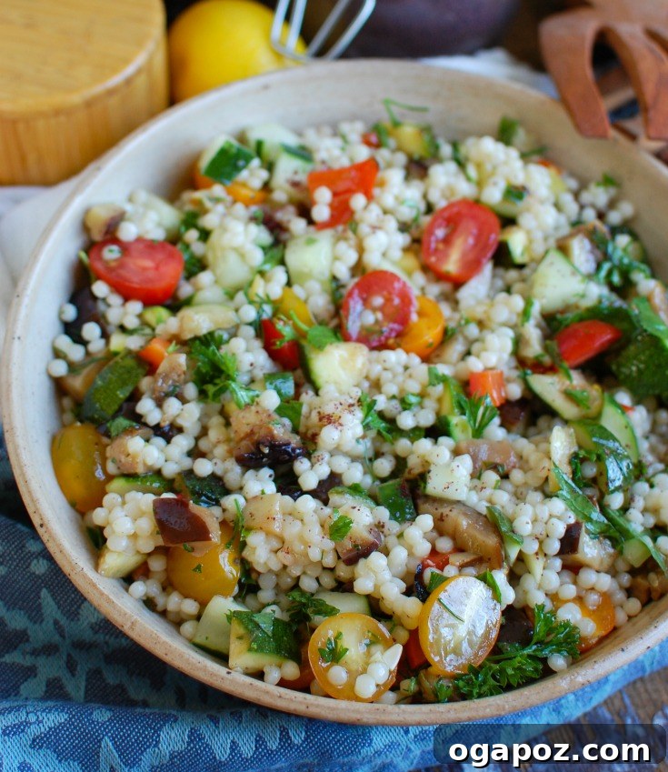 14 Sun-Kissed Mediterranean Grilling Recipes 3 Vibrant Mediterranean Grilled Vegetable Couscous Salad with zucchini, eggplant, bell peppers, tomatoes, cucumber, and fresh herbs.