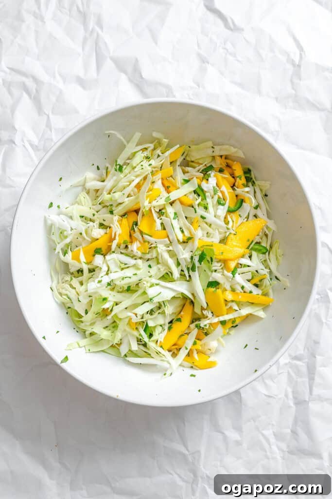 Effortless Tropical Mango Slaw 9 The dressing ingredients for Easy Mango Cabbage Coleslaw in a mason jar.