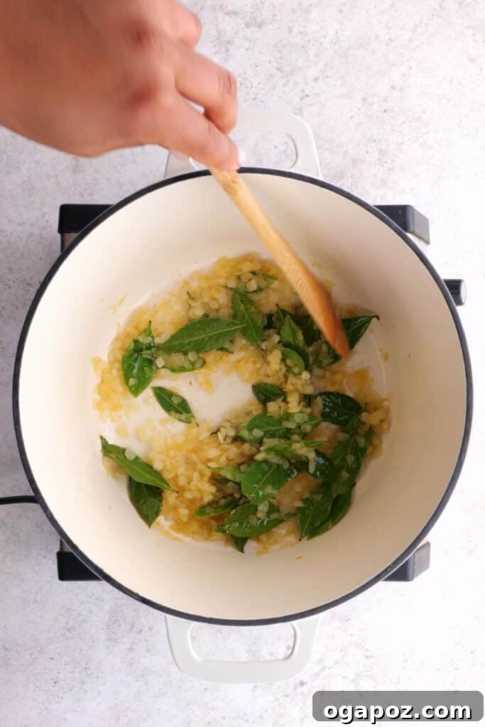 Chicken 65 A Zesty South Indian Classic 5 Frying onions and curry leaves for Chicken 65