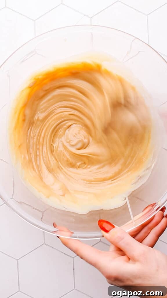 Two Ingredient Creamy Peanut Butter Fudge 5 Mixing peanut butter fudge in a bowl