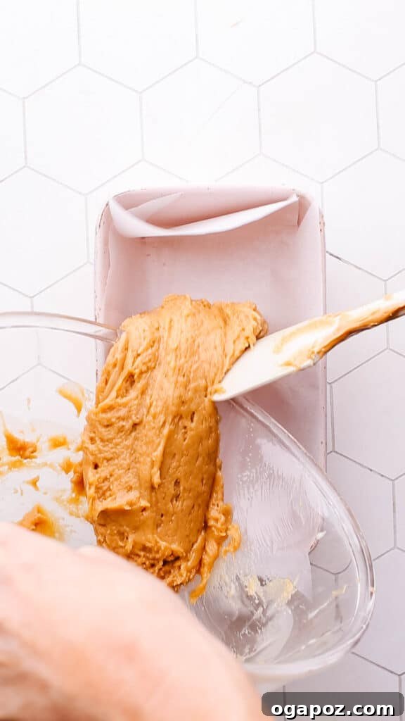 Two Ingredient Creamy Peanut Butter Fudge 6 Pouring fudge mixture into pan.