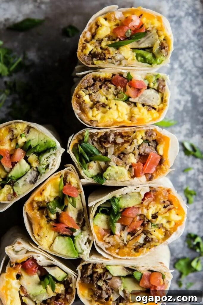 Delicious Breakfast Burritos, generously stuffed with avocado, pork sausage, crispy potatoes, and other flavorful fillings, wrapped in warm tortillas.