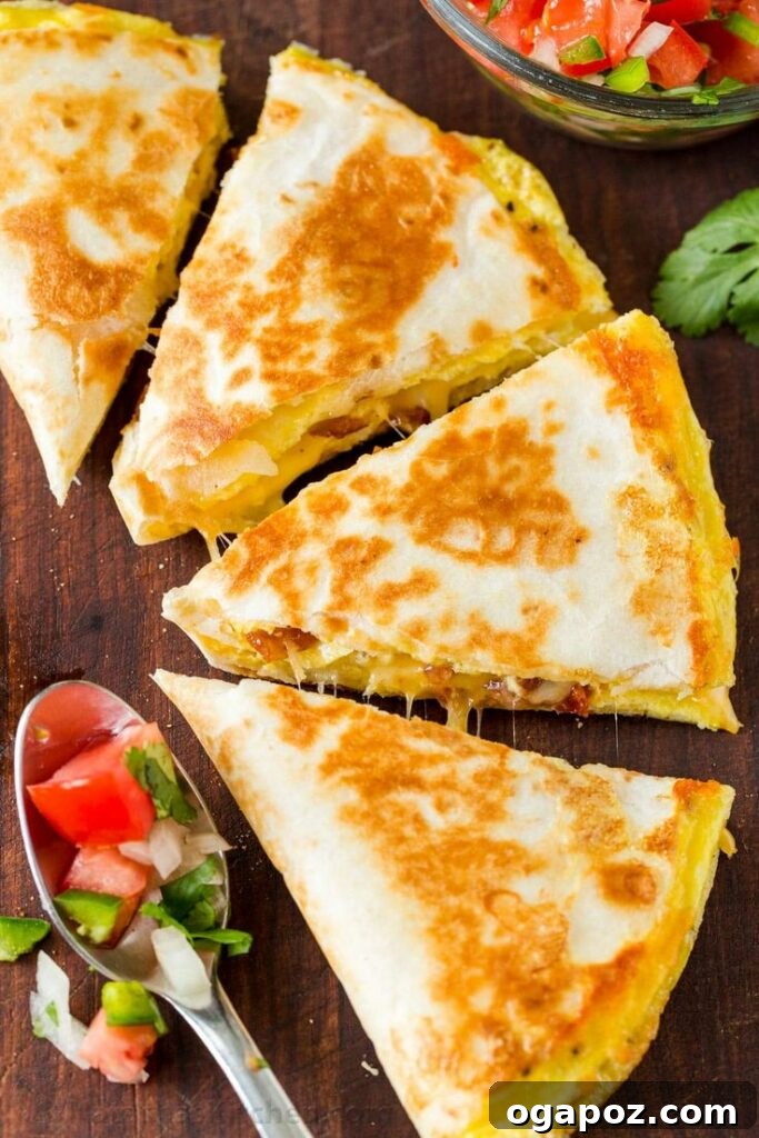 Cheesy Breakfast Quesadillas, prepared three ways with sausage, ham, and bacon, all golden and delicious, ready for a flavorful morning.