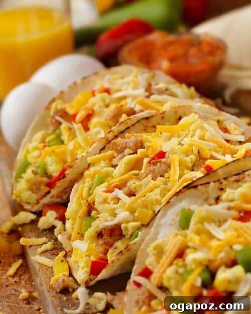 Savory Egg and Sausage Tacos, filled with fluffy scrambled eggs and seasoned sausage, served in warm tortillas with fresh toppings.