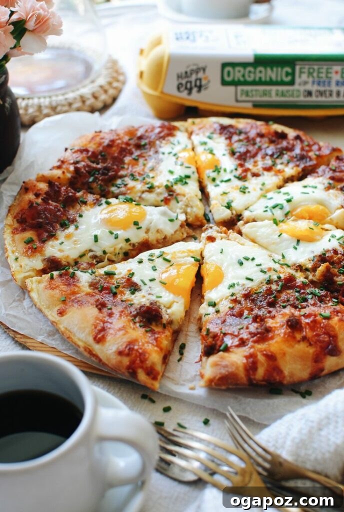 A tempting Breakfast Pizza, topped with savory sausage, fluffy scrambled eggs, and melted cheese, making for a fun and delicious morning meal.
