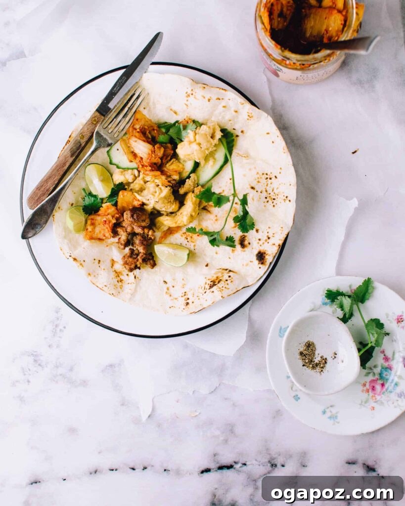 Vibrant Kimchi Sausage Breakfast Tacos, bursting with color and flavor, served in soft tortillas and ready for a unique morning treat.