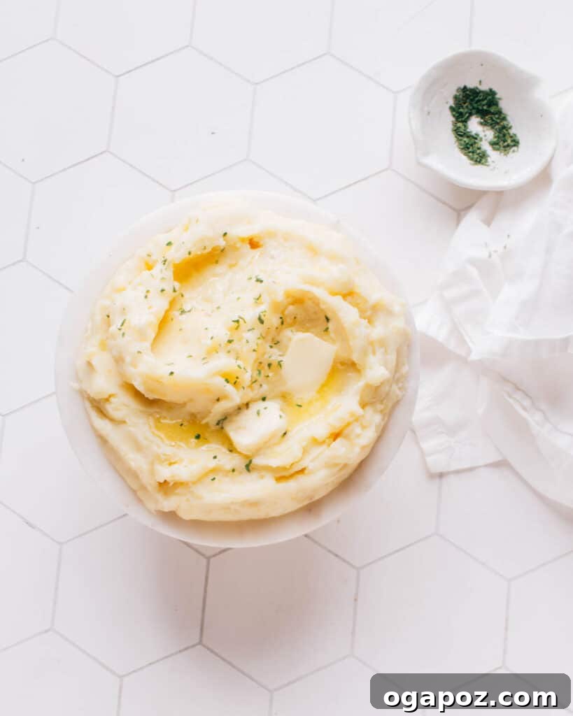 31 Delicious Side Dishes for Your Meatloaf Dinner 5 A bowl of fluffy mashed potatoes with melting butter.