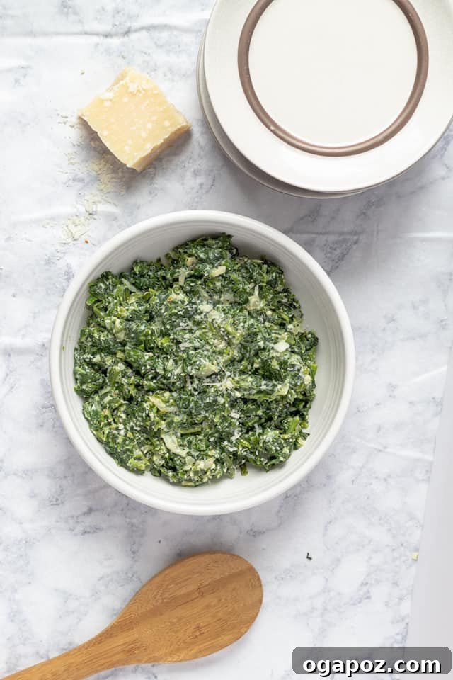 Effortless Healthy Sides for Meatloaf 35 Delicious Choices 26 A bowl of lightened-up creamed spinach, showing its creamy texture and vibrant green color, a perfect healthy side.