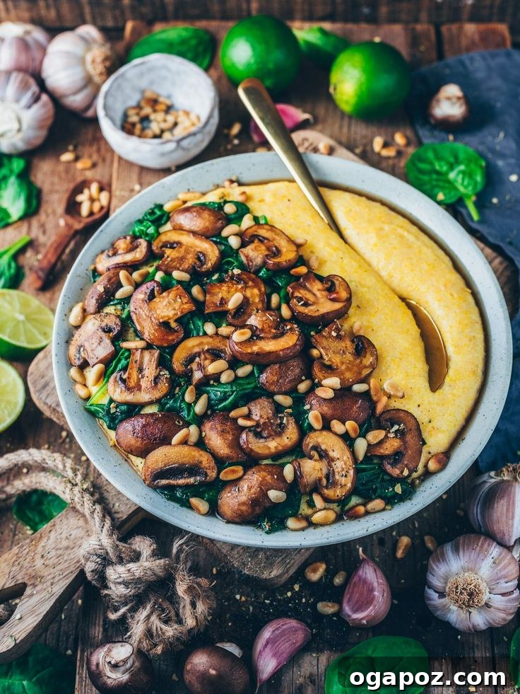Effortless Healthy Sides for Meatloaf 35 Delicious Choices 31 A bowl of creamy vegan polenta, generously topped with savory mushrooms and vibrant spinach, serving as a wholesome meatloaf side.
