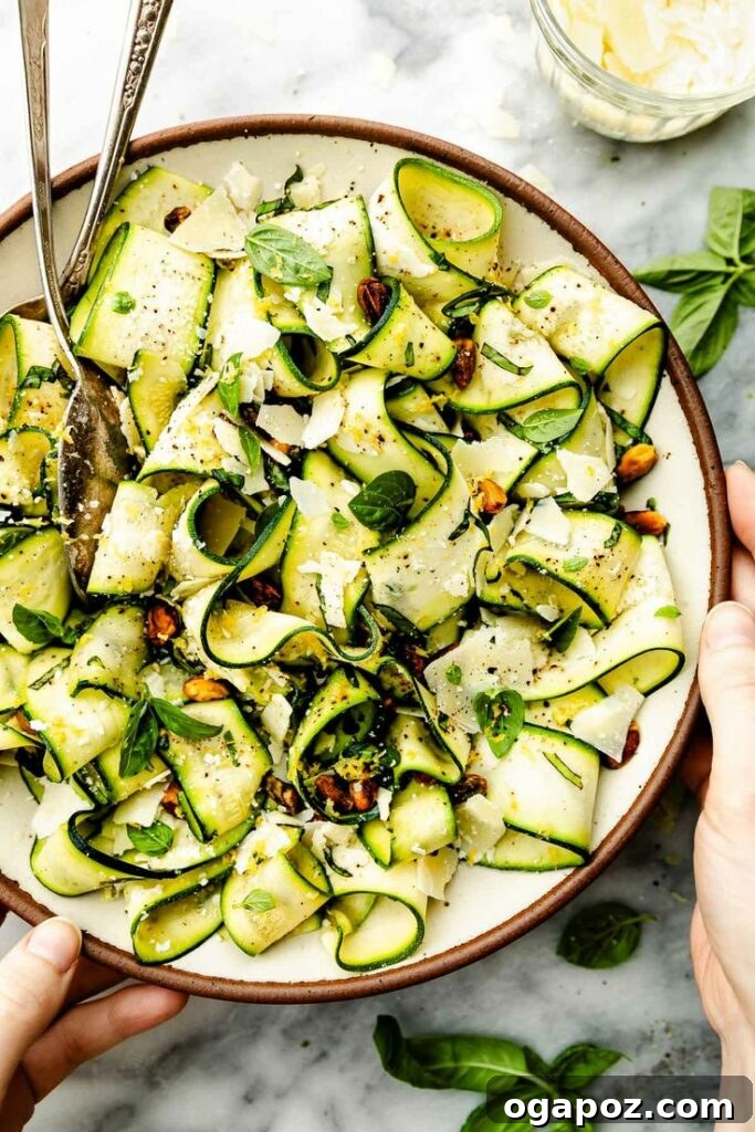 Effortless Healthy Sides for Meatloaf 35 Delicious Choices 32 A vibrant and fresh Shaved Zucchini Salad, presented as elegant ribbons, topped with pistachios and shaved Parmesan, making a healthy and beautiful side for meatloaf.