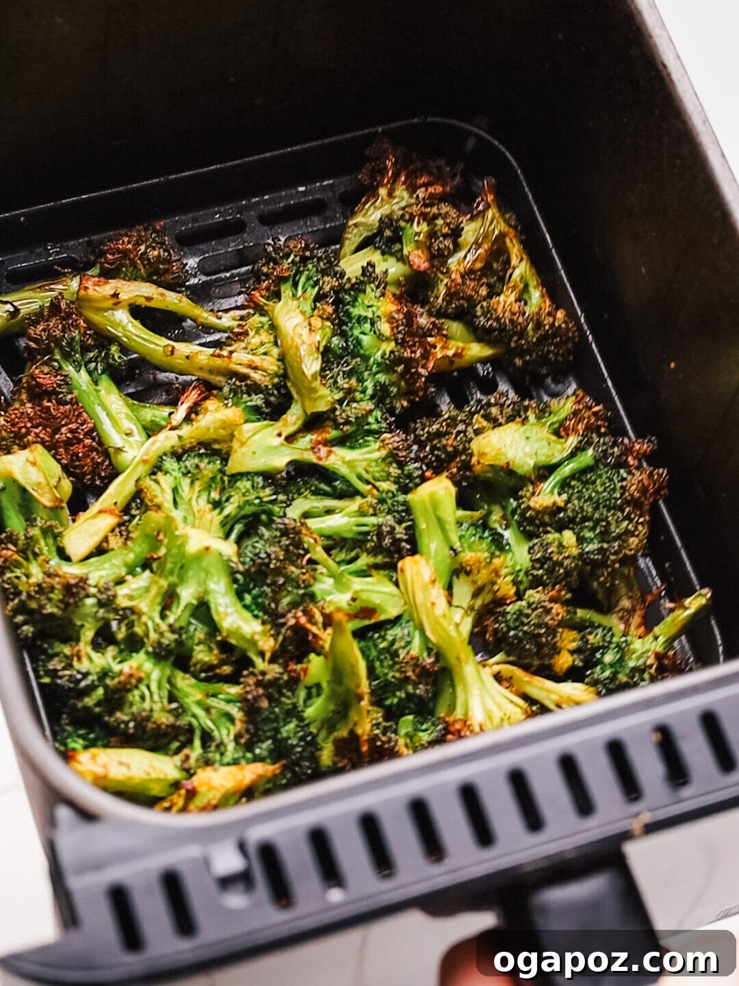 Effortless Healthy Sides for Meatloaf 35 Delicious Choices 6 A vibrant bowl of crispy broccoli florets, perfectly cooked in an air fryer and seasoned with chili flakes, ready to serve.