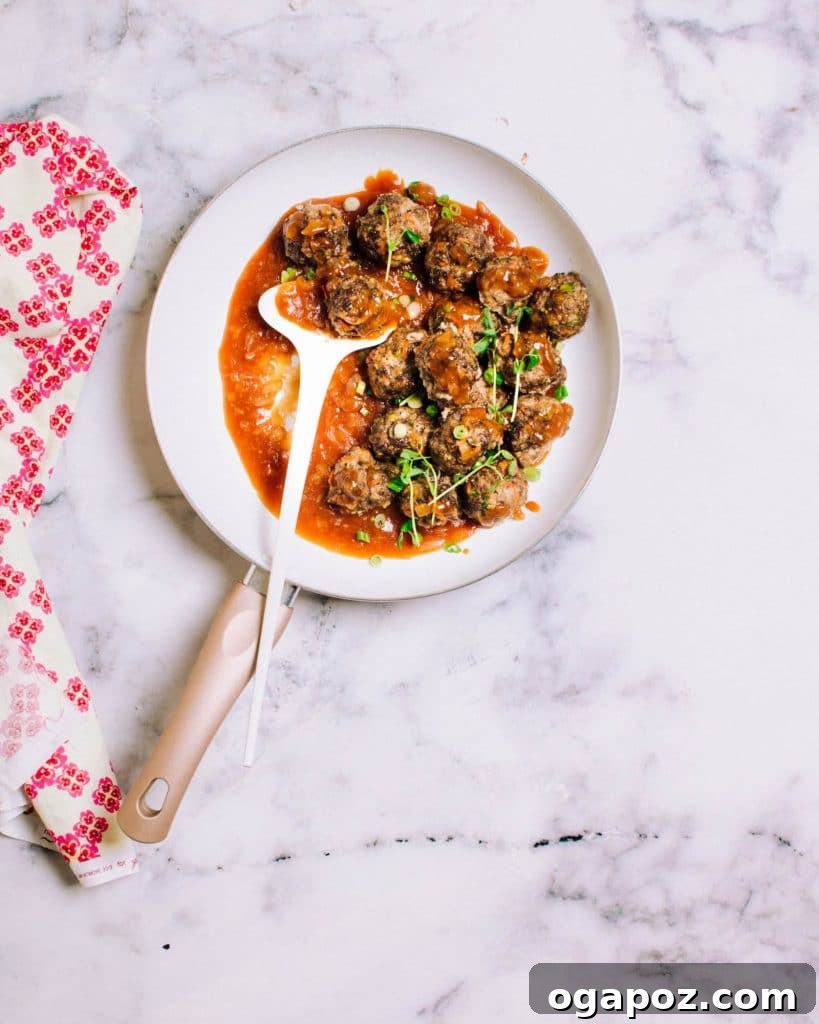 Beyond the Bowl: Essential Sides to Elevate Your Mac and Cheese 13 Sweet and sour meatballs coated in a glossy orange-ginger sauce.